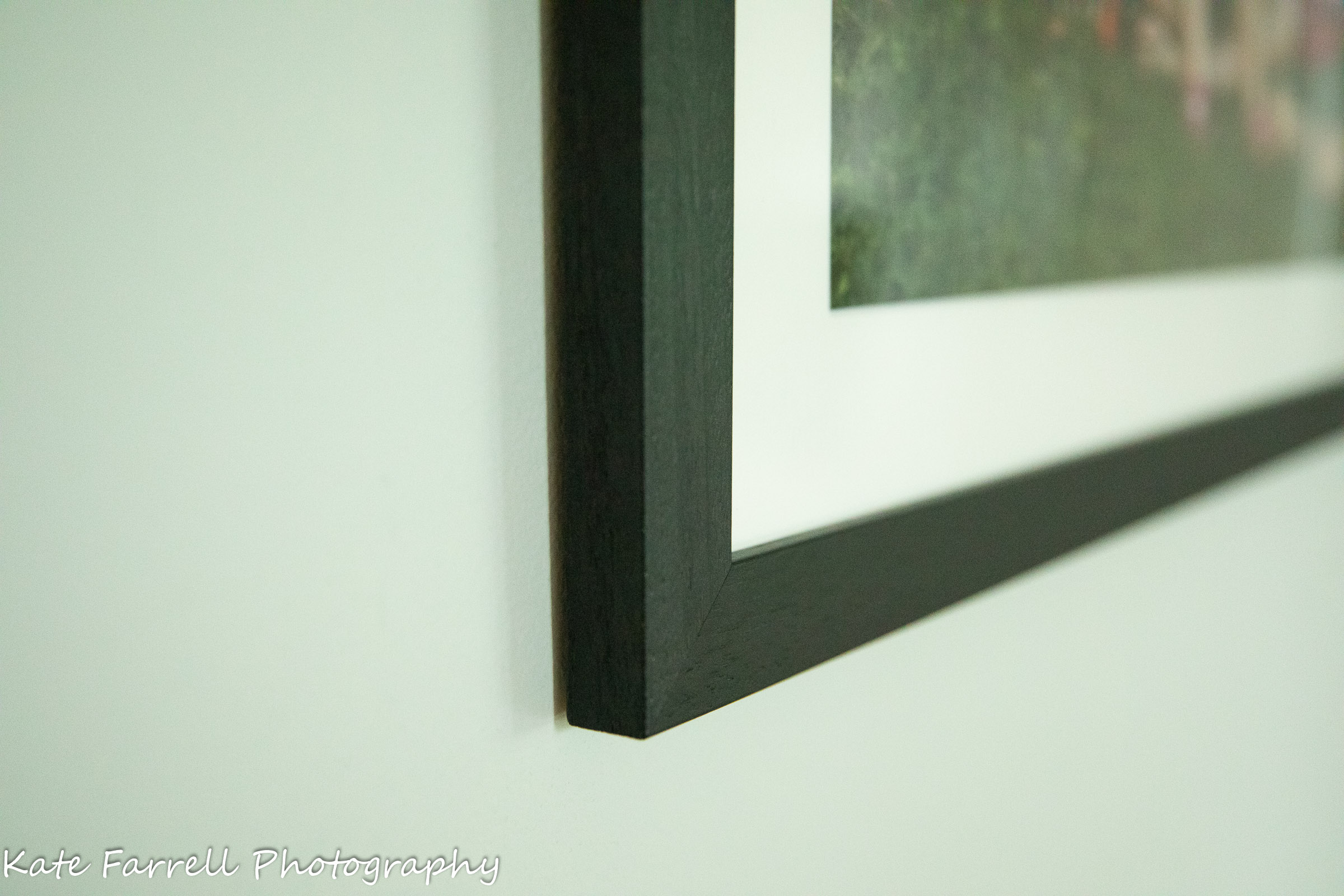 a black frame with a white mat