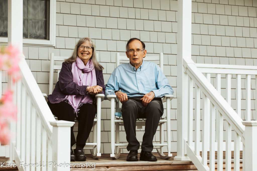 Vermont Grandparents sitting on their porch. 