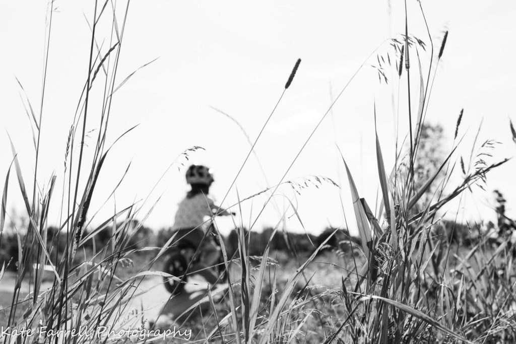 Girl riding her bike in Williston, Vermont. Professional photographer used the Sigma 35 mm Art lens for this image.
