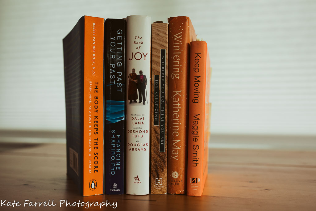 Five books sitting on a shelf
