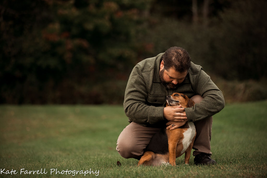 Man hugging his beagle to show the way pets can help us destress. 