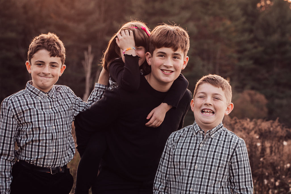 Four children at one of my Vermont family photo sessions. They are laughing and having fun.