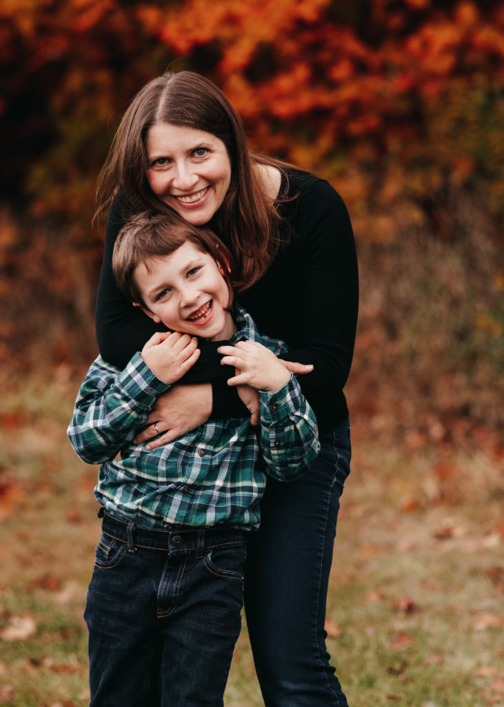 Mom hugging 5 year old son at a Vermont family photo session. 