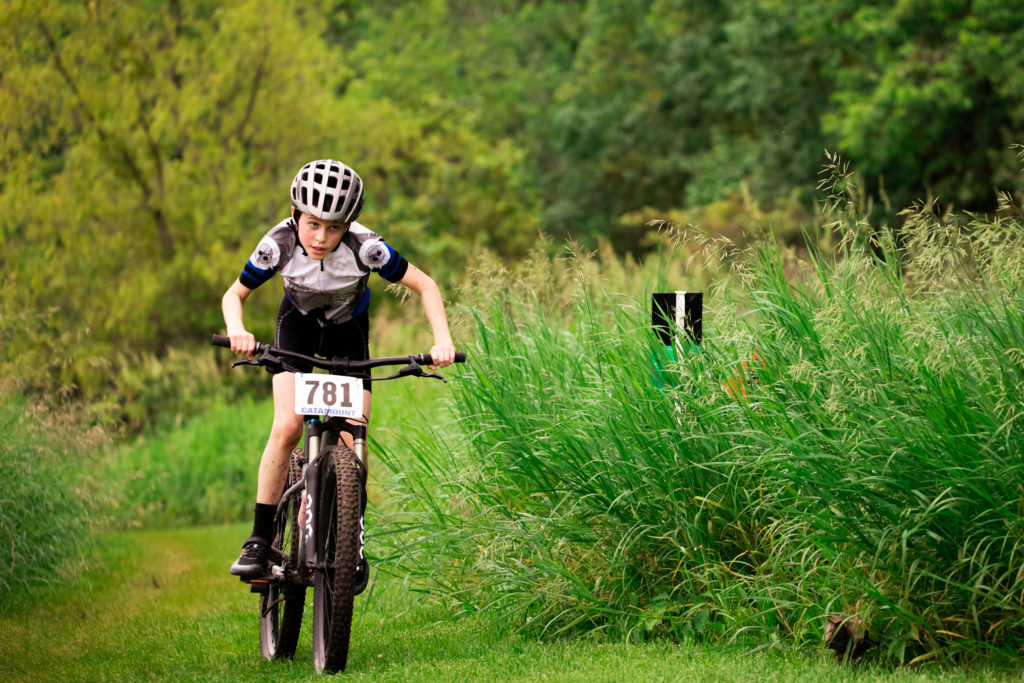 Professional Photographer photo of boy in a mountain bike race.