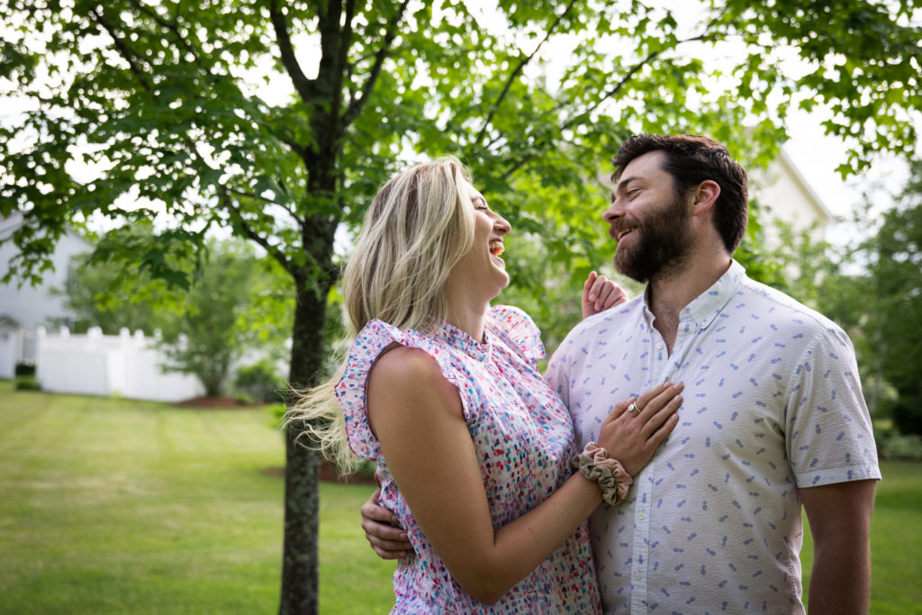 Professional photographer image of a couple laughing together.