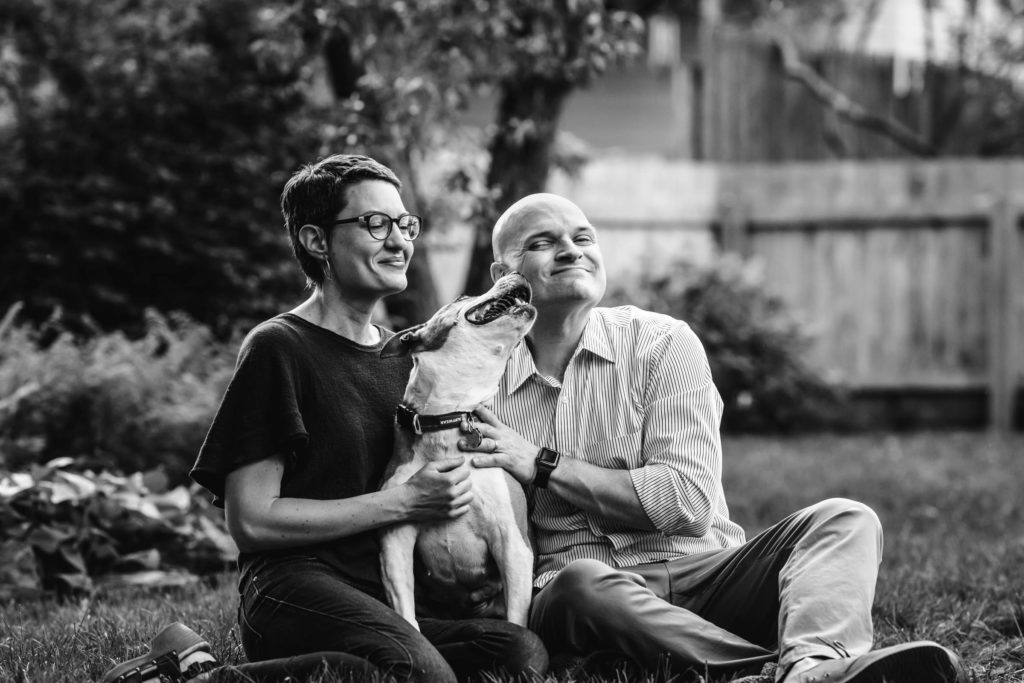 A couple with their beloved dog, another moment captured by a family photographer.