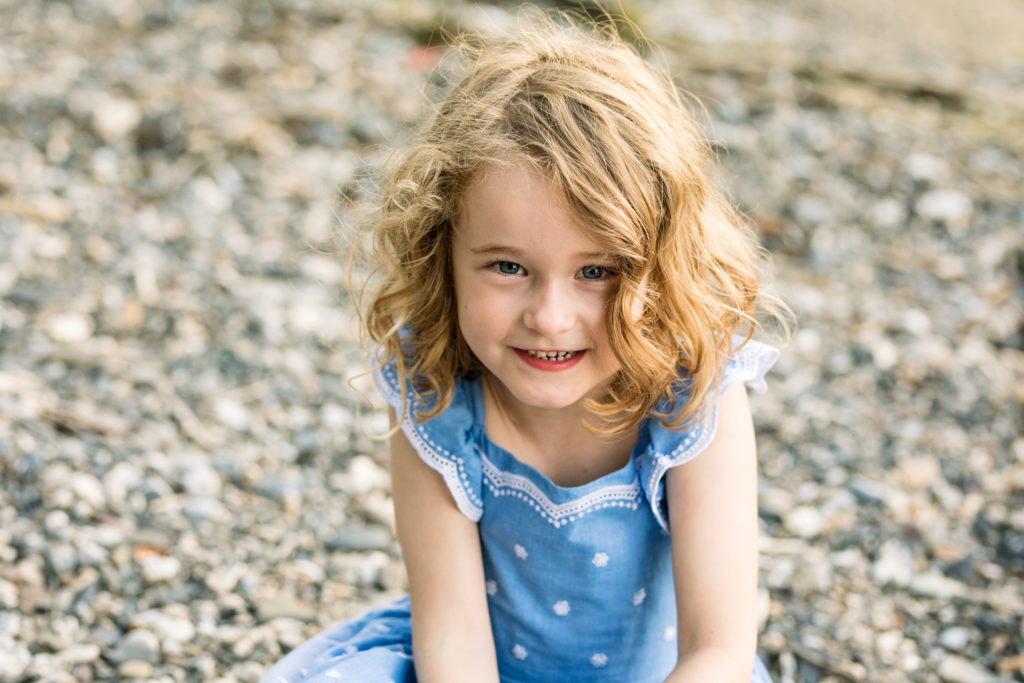 Sometimes, summer is the best time of year for family photos. This 4 year old loved sitting on the rocky shore for a portrait. 