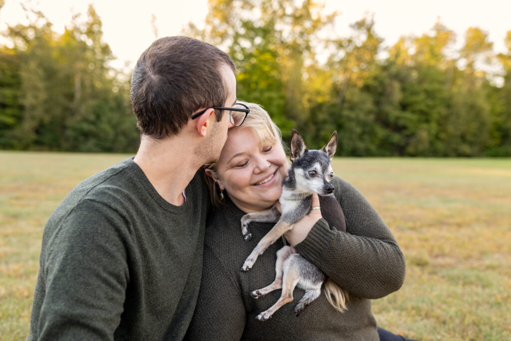 Family Lifestyle Photo of a couple with their small dog.